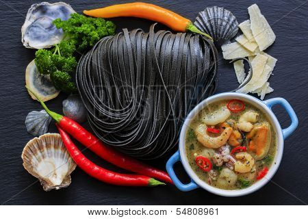 Italian cuisine - Fettuccine al nero di seppia with seafood