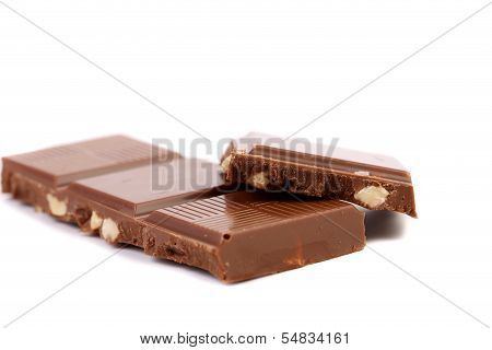 Tasty morsel of milk chocolate with nuts.