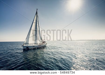 Sailing ship yachts with white sails