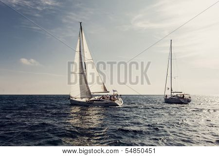 Sailing ship yachts with white sails