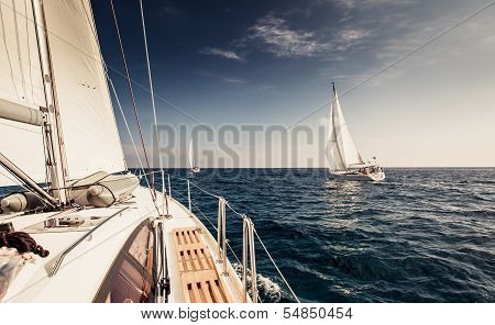 Sailing ship yachts with white sails