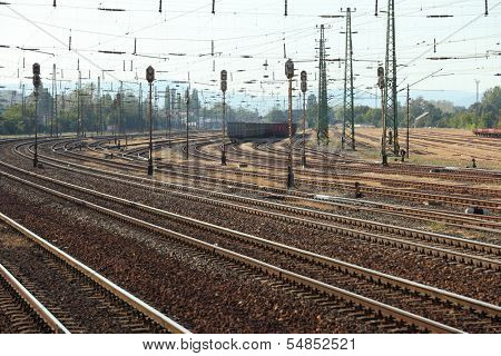 Many railway tracks with freight wagons