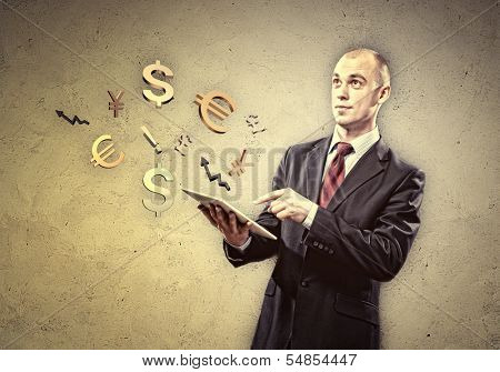 Image of businessman holding tablet pc. Finance concept