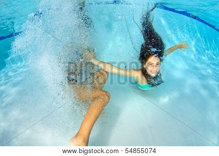 Two Girls Playing Underwater