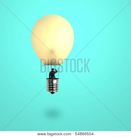 Man Taking Glowing Lamp Balloon Looking At Distant Place