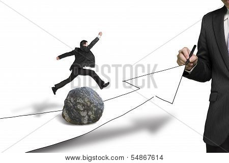 Businessman Drawing Road With Arrow, Another Jumping Over Rock