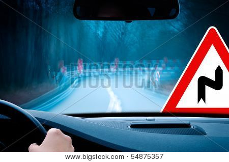 night driving - caution, curvy road