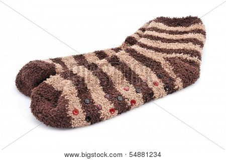 a pair of striped non-skid socks on a white background