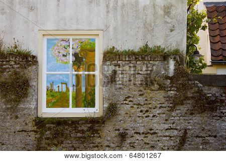 Painted Window On Stone Wall With Moss