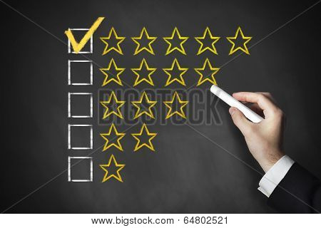 hand drawing rating stars on a chalk board