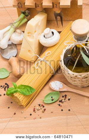 Bundle Of Uncooked Dried Italian Spaghetti And  Ingredients