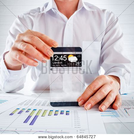 Futuristic Smart phone (phablet) with a transparent display in human hands. Concept actual future innovative ideas and best technologies humanity.