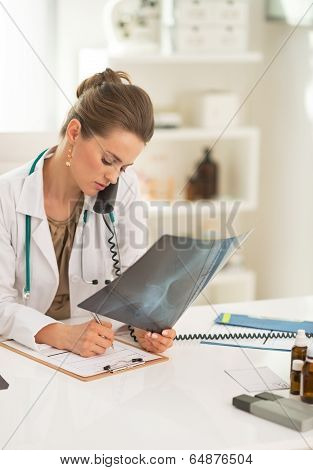 Medical Doctor Woman With Fluorography Talking Phone