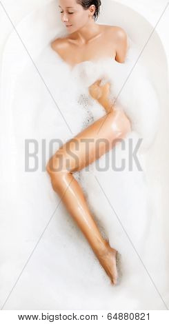 woman takes bubble bath