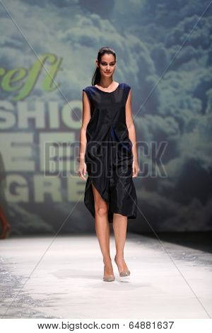 ZAGREB, CROATIA - MAY 09: Fashion model wearing clothes designed by Iva Karacic on the Zagreb Fashion Week on May 09, 2014 in Zagreb, Croatia.