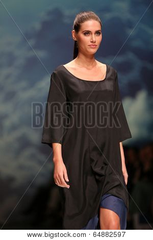 ZAGREB, CROATIA - MAY 09: Fashion model wearing clothes designed by Iva Karacic on the Zagreb Fashion Week on May 09, 2014 in Zagreb, Croatia.