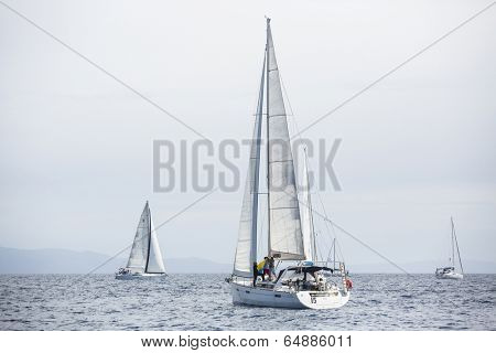 AEGEAN SEA, GREECE - APR 27, 2014: Unidentified sailboats participate in sailing regatta 