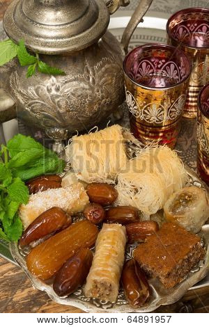 Traditional dates and cookies on a Moroccan tea tray 