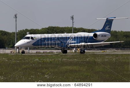 Dniproavia Airlines Embraer ERJ-145LR aircraft preparing for take-off from the runway