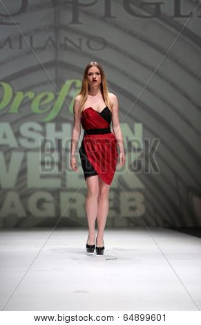 ZAGREB, CROATIA - MAY 09: Fashion model wearing clothes designed by Avaro Figlio on the Zagreb Fashion Week on May 09, 2014 in Zagreb, Croatia.