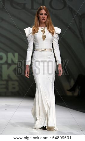 ZAGREB, CROATIA - MAY 09: Fashion model wearing clothes designed by Avaro Figlio on the Zagreb Fashion Week on May 09, 2014 in Zagreb, Croatia.