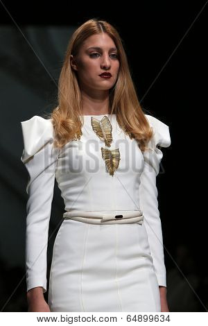 ZAGREB, CROATIA - MAY 09: Fashion model wearing clothes designed by Avaro Figlio on the Zagreb Fashion Week on May 09, 2014 in Zagreb, Croatia.