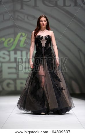 ZAGREB, CROATIA - MAY 09: Fashion model wearing clothes designed by Avaro Figlio on the Zagreb Fashion Week on May 09, 2014 in Zagreb, Croatia.