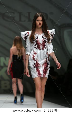 ZAGREB, CROATIA - MAY 09: Fashion model wearing clothes designed by Avaro Figlio on the Zagreb Fashion Week on May 09, 2014 in Zagreb, Croatia.