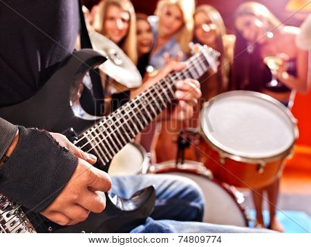 Group peole playing  drum in night club.