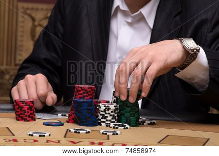 Handsome man and beautiful woman in casino