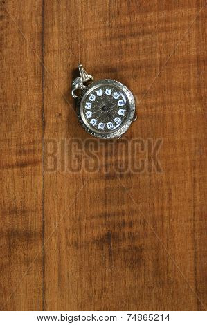 Old watch on wodden background
