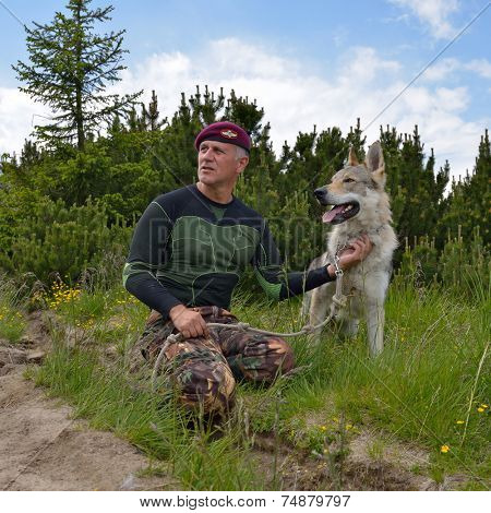Man and his purebred Czechoslovakian wolf dog
