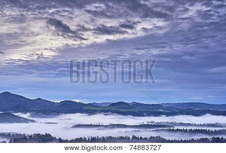 Hilly Landscape With Fog