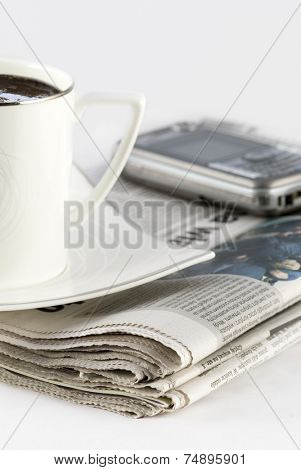 Black coffee and newspaper. Breakfast