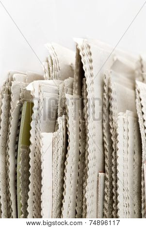 newspaper stack on white background