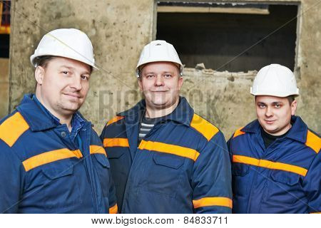 three industrial engineer chief discussing enterprise development in house-building plant