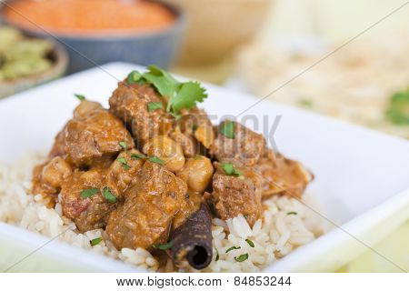 Beef curry served on a bed of rice