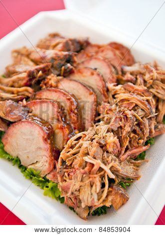 BBQ Pulled pork butt on a bed of parsley
