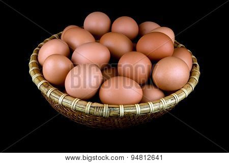 Basket Of Fresh Hens Eggs On Black Background