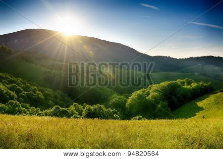 Pale of light. Morning on mountain hills. Holbav