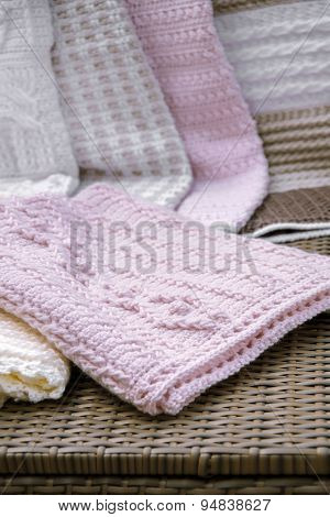 Crochet, Cable Knit Baby Blanket in Pink Color on Sofa
