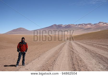 Young man tourist in Atacama Desert in Bolivia