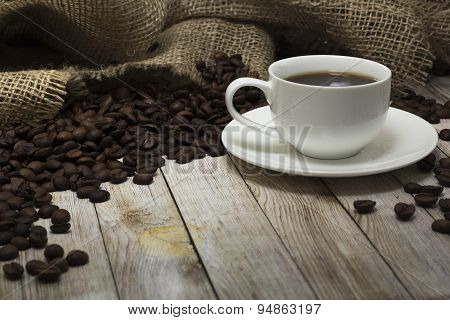 Cup Of Coffee And Coffee Beans