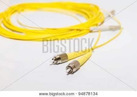 Close up of a fiber optic patchcord on white background
