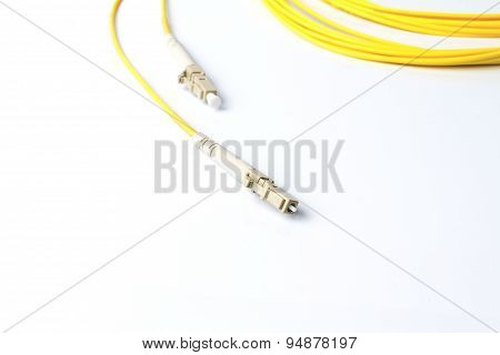 Close up of a fiber optic patchcord on white background