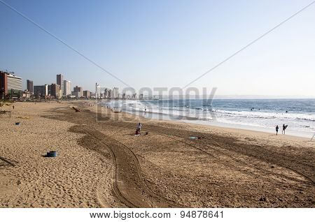 People On Beach Against City Skyline In Durban