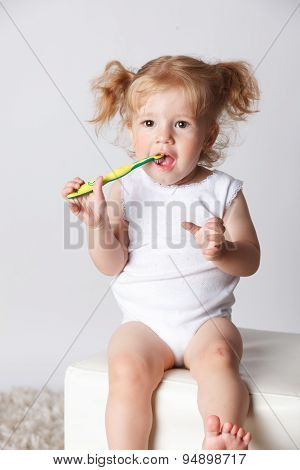 Sweet Little Child Brushing Her Teeth