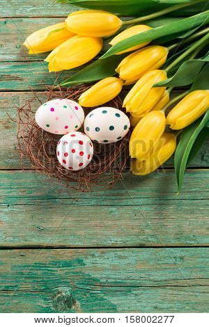 Easter Background Yellow Tulips On Wooden Table, Rabbit, Eggs,nest Candy