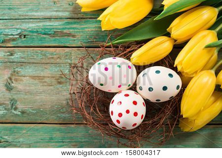 Easter Background Yellow Tulips On Wooden Table, Rabbit, Eggs,nest Candy