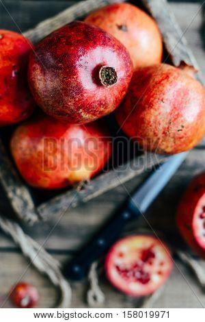 Ripe Pomegranate Fruit On Wooden Vintage Background. Red Juice P